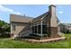 Rear exterior view highlighting the stone fireplace and screened-in porch, perfect for outdoor living at 6506 Jepson Ct # 349, Charlotte, NC 28214