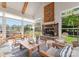 Bright living area with stone fireplace, vaulted ceilings, wooden beams, large windows, and stylish decor at 6506 Jepson Ct # 349, Charlotte, NC 28214