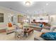 Open-concept living room with neutral colors, hardwood floors, and seamless access to the kitchen and dining areas at 6506 Jepson Ct # 349, Charlotte, NC 28214