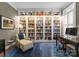 Office featuring built-in bookshelves, a comfortable chair, and a desk, creating an ideal workspace at 6506 Jepson Ct # 349, Charlotte, NC 28214
