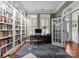 Bright home office with built-in bookshelves and natural light, creating an inspiring workspace at 6506 Jepson Ct # 349, Charlotte, NC 28214