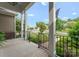 Covered front porch with black railing, offering a view of the landscaped yard and quiet neighborhood at 6506 Jepson Ct # 349, Charlotte, NC 28214