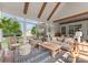 Cozy sunroom featuring vaulted ceilings with wood beams, comfortable seating, and abundant natural light at 6506 Jepson Ct # 349, Charlotte, NC 28214