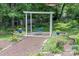 Beautifully landscaped backyard featuring a gravel path and an outdoor sitting area at 7029 Forest Hills Dr # 38, Denver, NC 28037