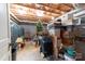 Unfinished basement used for storage, including storage bins, a small Christmas tree and cages at 7029 Forest Hills Dr # 38, Denver, NC 28037