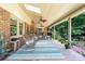 Spacious, covered porch with ceiling fans and comfortable seating, perfect for outdoor relaxation at 7029 Forest Hills Dr # 38, Denver, NC 28037