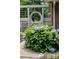 Lush hydrangea bush with blue flowers near the house, adding curb appeal at 7029 Forest Hills Dr # 38, Denver, NC 28037