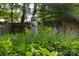 Charming garden statue surrounded by lush greenery with a bird house overhead at 7029 Forest Hills Dr # 38, Denver, NC 28037