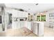 Kitchen featuring white cabinets, stainless steel appliances, tile flooring, and an eat-in dining area at 7029 Forest Hills Dr # 38, Denver, NC 28037