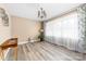 Bright living room with neutral walls, wood flooring, and a large window with floral curtains at 7029 Forest Hills Dr # 38, Denver, NC 28037