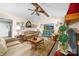 Cozy living room with vaulted ceiling, a ceiling fan, a fireplace, and comfortable seating at 7029 Forest Hills Dr # 38, Denver, NC 28037