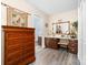 Bathroom vanity area with a make-up counter, wood flooring, and an adjacent toilet room at 7029 Forest Hills Dr # 38, Denver, NC 28037