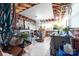 Brightly lit workshop with several tables, tools, plants, and exposed rafters at 7029 Forest Hills Dr # 38, Denver, NC 28037
