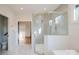 Contemporary bathroom with glass shower and views into walk-in closet at 705 Mcalway Rd, Charlotte, NC 28211