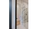 Modern bathroom with marble tile shower, glass enclosure, and gold hardware, blending luxury and functionality seamlessly at 705 Mcalway Rd, Charlotte, NC 28211