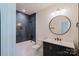 Bathroom featuring dark herringbone tile and modern fixtures at 705 Mcalway Rd, Charlotte, NC 28211