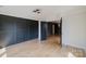 Spacious bedroom featuring hardwood floors, panel wall, and ample natural light at 705 Mcalway Rd, Charlotte, NC 28211
