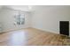 Bedroom with hardwood floors and natural light from the window at 705 Mcalway Rd, Charlotte, NC 28211