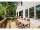 Inviting deck with wood railing offering an outdoor dining area, perfect for enjoying the surrounding views at 705 Mcalway Rd, Charlotte, NC 28211