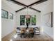 Dining room featuring black trim windows, natural light, and modern light fixture at 705 Mcalway Rd, Charlotte, NC 28211