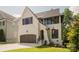 Charming two-story home with a brick and siding exterior, a two-car garage, and professional landscaping at 705 Mcalway Rd, Charlotte, NC 28211