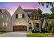 Beautiful two-story home featuring painted brick, dark shutters, and a three car garage at 705 Mcalway Rd, Charlotte, NC 28211