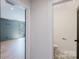 Hallway view of bathroom and bonus room entryways at 705 Mcalway Rd, Charlotte, NC 28211