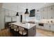 Modern kitchen with stainless steel appliances, pendant lighting, and quartz counters at 705 Mcalway Rd, Charlotte, NC 28211
