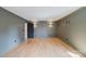 This living area has light grey walls, hardwood floors, and ample recessed lighting at 705 Mcalway Rd, Charlotte, NC 28211