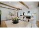Open floor plan living room next to island kitchen featuring hardwood floors and neutral color palette at 705 Mcalway Rd, Charlotte, NC 28211