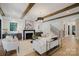 Bright, neutral living room featuring hard wood floors, a fireplace, and an open floor plan at 705 Mcalway Rd, Charlotte, NC 28211