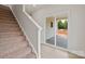 Carpeted stairs with a sliding glass door leading to the outside patio at 7214 Jerimoth Dr, Charlotte, NC 28215