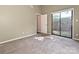 Bright bedroom with sliding glass doors that leads to the backyard patio at 7916 Charter Oak Ln, Charlotte, NC 28226