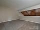 Lofted bedroom with carpet and unique wood plank ceiling at 7916 Charter Oak Ln, Charlotte, NC 28226