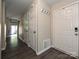 Inviting entryway with hardwood floors, coat hooks and easy access to the living areas at 7916 Charter Oak Ln, Charlotte, NC 28226