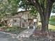 Charming brick townhome featuring a landscaped front yard and inviting entrance at 7916 Charter Oak Ln, Charlotte, NC 28226