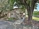 Charming brick townhome featuring a landscaped front yard and inviting entrance at 7916 Charter Oak Ln, Charlotte, NC 28226
