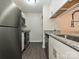 Well-lit kitchen features stainless steel appliances and granite countertops at 7916 Charter Oak Ln, Charlotte, NC 28226
