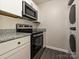 Modern kitchen features stainless steel appliances and granite countertops at 7916 Charter Oak Ln, Charlotte, NC 28226