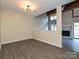 Open-concept living room with fireplace and hardwood flooring, ideal for entertaining at 7916 Charter Oak Ln, Charlotte, NC 28226