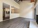 Bright living room featuring hardwood floors, a fireplace and high ceilings at 7916 Charter Oak Ln, Charlotte, NC 28226