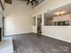 Spacious living area with hardwood floors, stairs and views to the kitchen at 7916 Charter Oak Ln, Charlotte, NC 28226