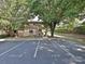 Exterior shot featuring parking and landscaping near the home at 7916 Charter Oak Ln, Charlotte, NC 28226
