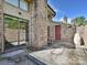 Private brick patio area, enclosed by a brick fence, perfect for outdoor gatherings and relaxation at 7916 Charter Oak Ln, Charlotte, NC 28226