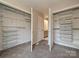 Generous walk-in closet with ample adjustable shelving, perfect for organizing clothing and accessories at 7916 Charter Oak Ln, Charlotte, NC 28226