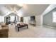 Versatile bonus room with gym, TV, couch, and stylish decor at 8102 Bergen Ct, Waxhaw, NC 28173