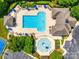Aerial view of the community pool with ample seating, water features, and a clubhouse at 8102 Bergen Ct, Waxhaw, NC 28173