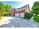Spacious three-car garage with a large driveway and basketball hoop near the back at 8102 Bergen Ct, Waxhaw, NC 28173