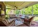 Relaxing screened porch with ample seating and a view of lush greenery at 8102 Bergen Ct, Waxhaw, NC 28173