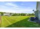 Spacious backyard featuring expansive lawn space, a fence, and an air conditioning unit at 8312 Compton Acres Ln, Waxhaw, NC 28173